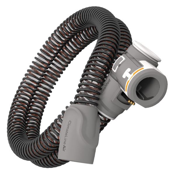 Black corrugated CPAP hose connected to a grey plastic mask swivel and connector piece.