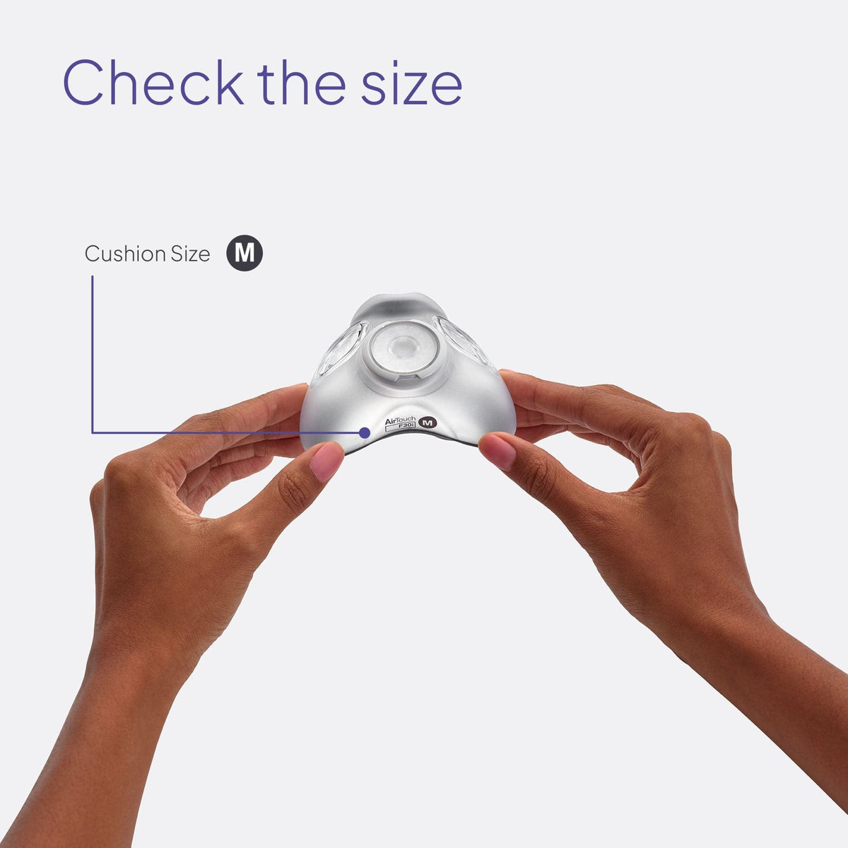 Hands holding an AirTouch F30i cushion to show where its size letter is printed on the shell