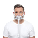 Photo of a man wearing the AirFit F40 from the front, the cushion under his nose and over his mouth