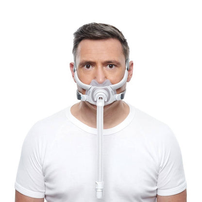 Photo of a man wearing the AirFit F40 from the front, the cushion under his nose and over his mouth