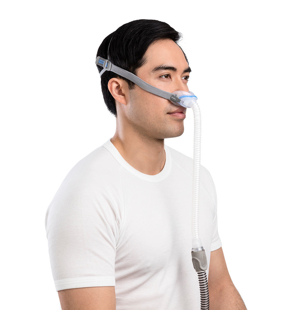 Side photo of a man wearing the AirFit N30, the short tube running down from under his nose