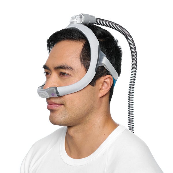Side photo of a man wearing the AirFit N30i, with the tube leaving from the top of his head