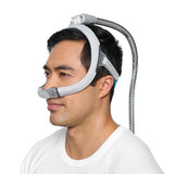 Side photo of a man wearing the AirFit N30i, with the tube leaving from the top of his head