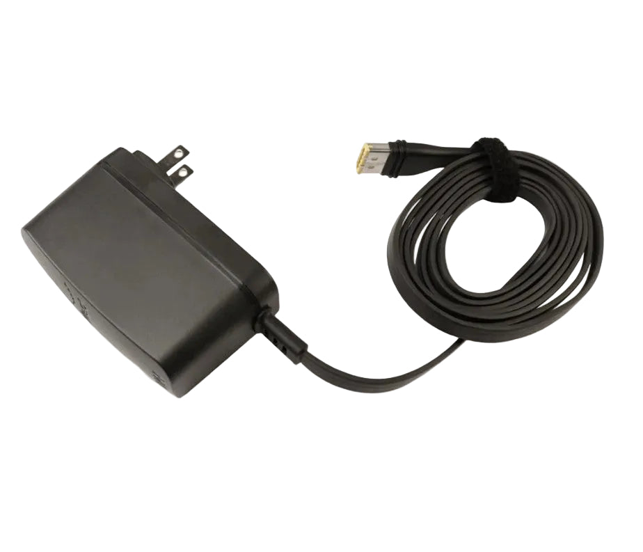 Front view of the ResMed AirMini 20W power supply with its North American wall plug and coiled flat cable