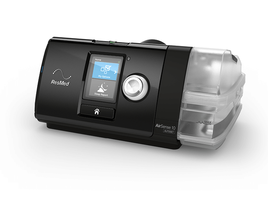 Three-quarter view of the ResMed AirSense 10 AutoSet with the HumidAir water tub fitted on its right side