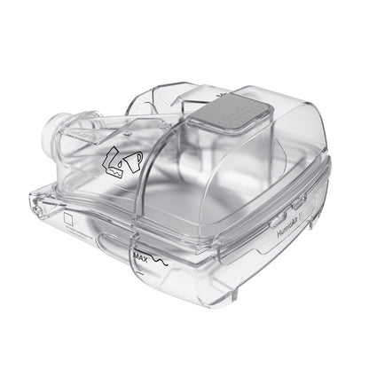 Angled view of the clear HumidAir 11 cleanable tub for AirSense 11, showing the grey grip and the max mark
