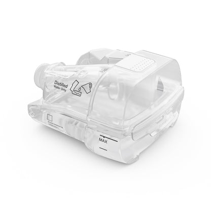 ResMed HumidAir 11 standard tub at a three-quarter angle, its lid showing the white grip and distilled water print