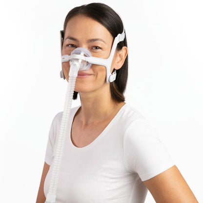 Photo of a woman wearing the AirTouch N20 For Her from the front, the tube running down
