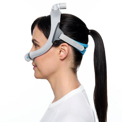 Side photo of a woman wearing the AirTouch N30i, her ponytail passing through the headgear