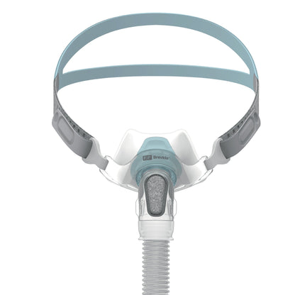 Front view of the Fisher & Paykel Brevida nasal pillows mask, with teal headgear and a grey elbow diffuser
