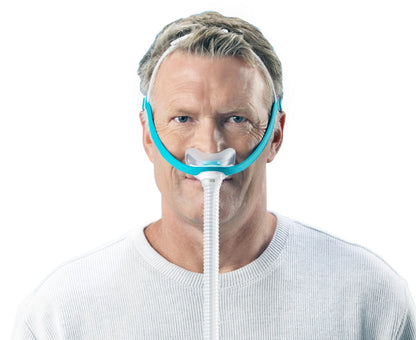 Photo of a man wearing the Evora Nasal from the front, the seal sitting just under his nose