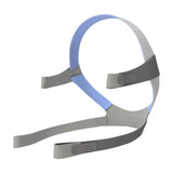Angled view of the standard AirFit F10 headgear, grey straps with a blue crown and four fastening tabs