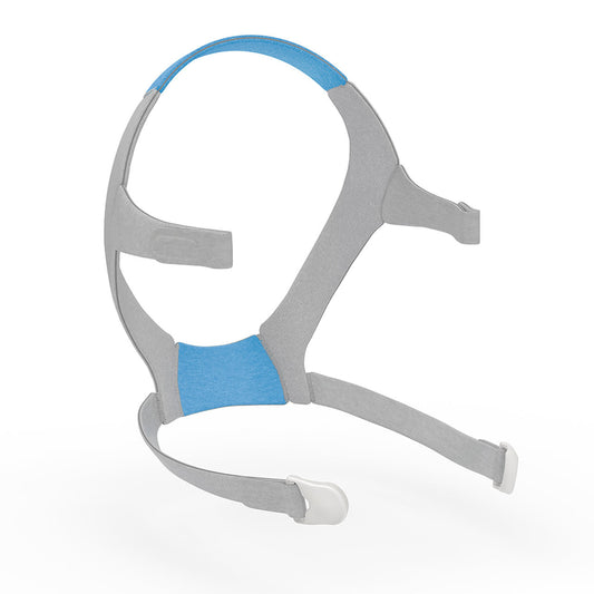 ResMed F20 headgear in grey fabric, blue panels at the crown and nape, magnetic clips at each lower strap end