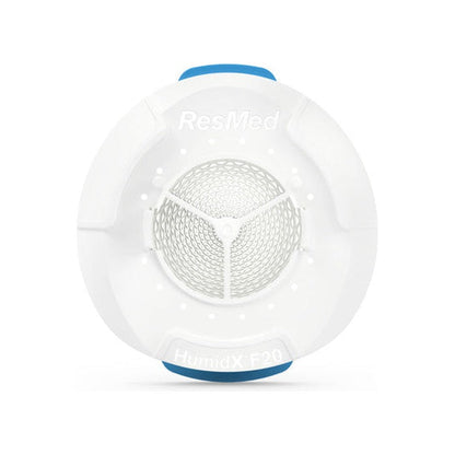 Front view of the round HumidX F20 waterless humidifier with its blue tabs at the top and bottom