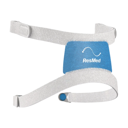 Left side view of the F30i headgear, its blue back panel between light grey straps and a magnetic clip