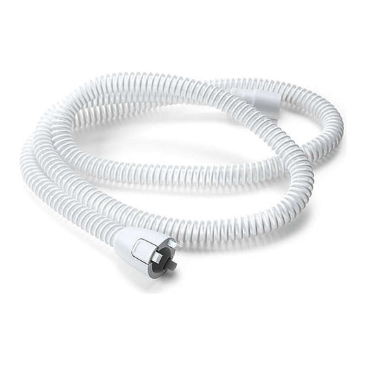 Philips DreamStation 15 mm heated tube coiled on white, with its heated connector and pins at the machine end