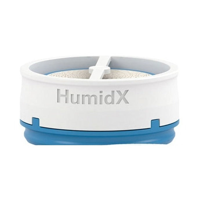 Front view of the ResMed HumidX waterless humidifier for AirMini, a white disc with a blue base