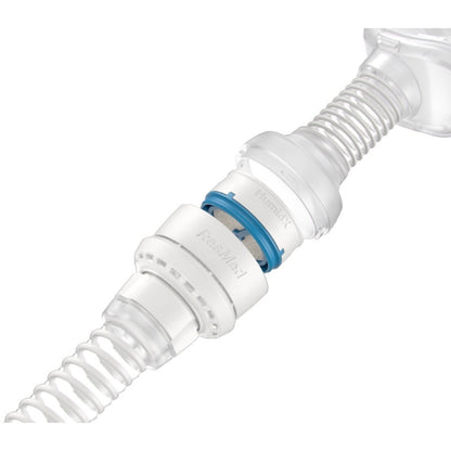 HumidX seated in the AirMini mask connector between the vent module and the mask tube
