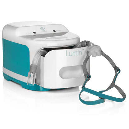 Angled view of the Lumin sanitizer with a nasal pillow CPAP mask and its tubing resting in the open drawer