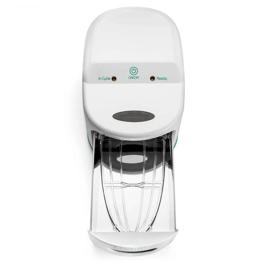 Front view of the Lumin UV-C sanitizer with its drawer pulled open, showing the clear rack and reflective lining