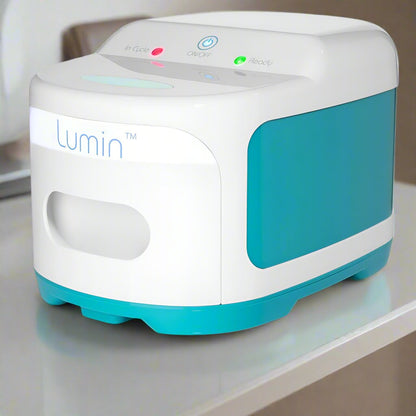 The Lumin UV-C sanitizer sitting closed on a white shelf, ready for its next cycle
