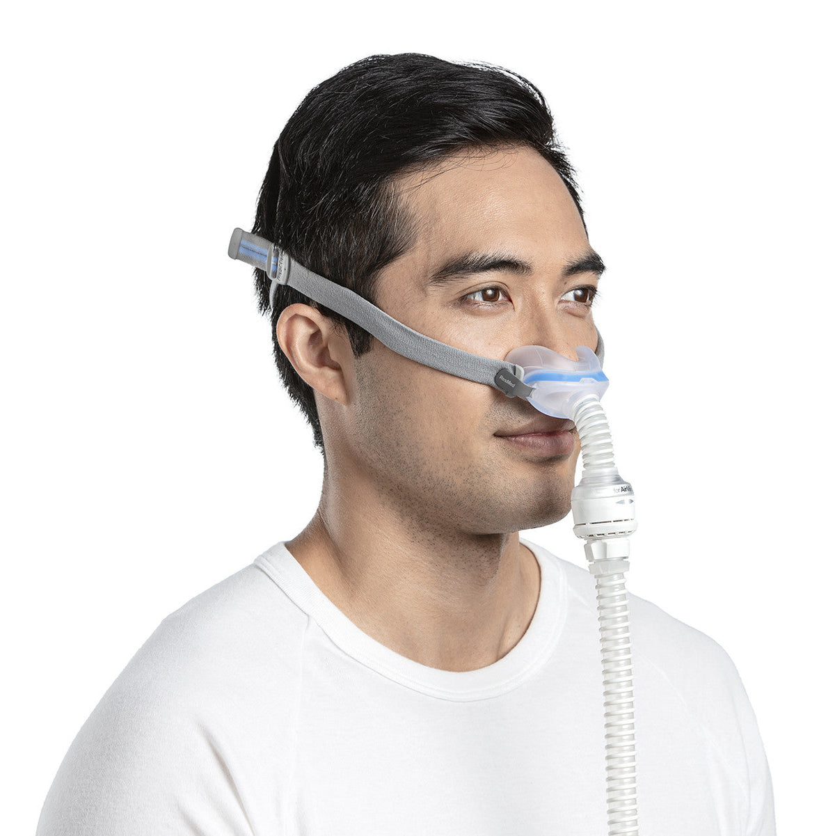 Side photo of a man wearing the AirFit N30 for AirMini, the tube running down from the vent module