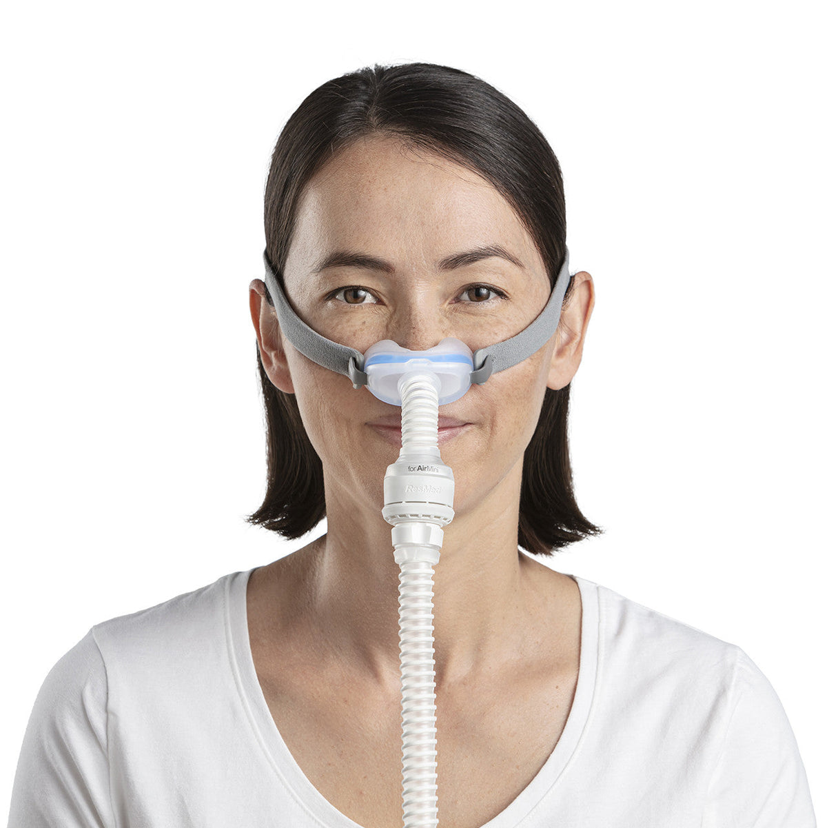 Photo of a woman wearing the AirFit N30 for AirMini from the front, the cushion sitting under her nose