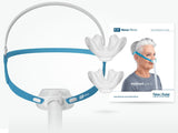 The Nova Micro mask shown beside two spare pillows cushions and Fisher & Paykel's quick reference guide