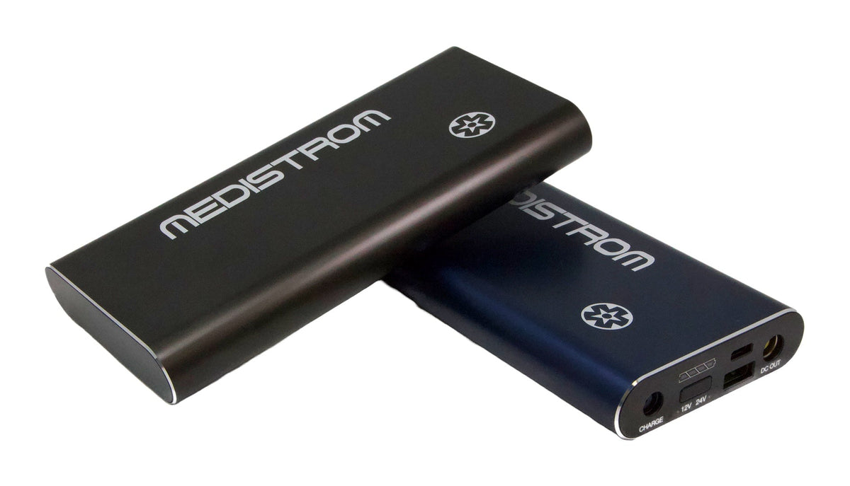Angled view of the Pilot Flex battery in Charcoal and Dark Navy, showing the charge, USB and DC output ports