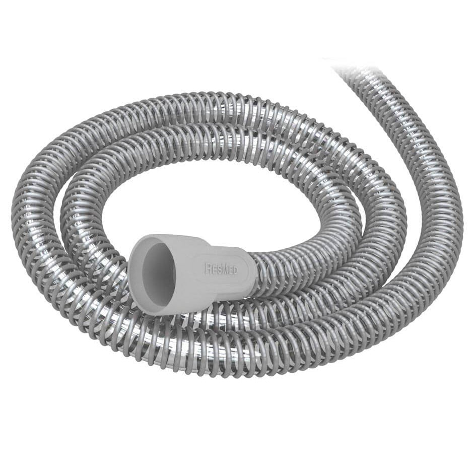 Coiled ResMed SlimLine tube in grey, with the ResMed cuff at one end facing the camera